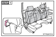 Pull the lever and fold down the seatback.