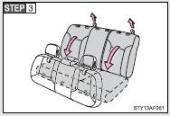 Fold down the seatback by pulling the lock release strap.