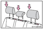 Align the head restraint with the installation holes and push it down to the