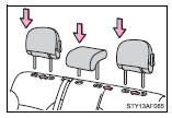 Align the head restraint with the installation holes and push it down to the