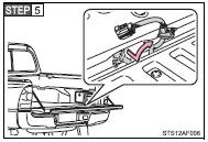 Pull out the wire harness from the vehicle bed.