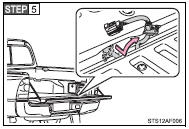 Pull out the wire harness from the vehicle bed.