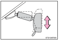 Adjust the height of the rear view mirror by moving it up and down.