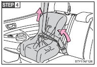 While pushing the child seat into the seat, allow the shoulder belt to retract