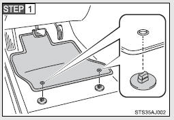 Insert the retaining hooks (clips) into the floor mat eyelets.