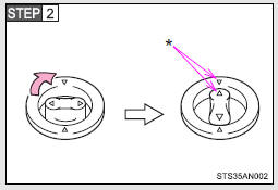 Turn the upper knob of each retaining hook (clip) to secure the floor mats in