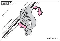 Insert the locking plate into the deck rail, rotate the tie-down cleat 90°, and