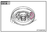 Release the bulb retaining spring.