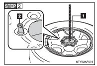 4WD models only: Fasten the claws of the holding bracket into the wheel holes