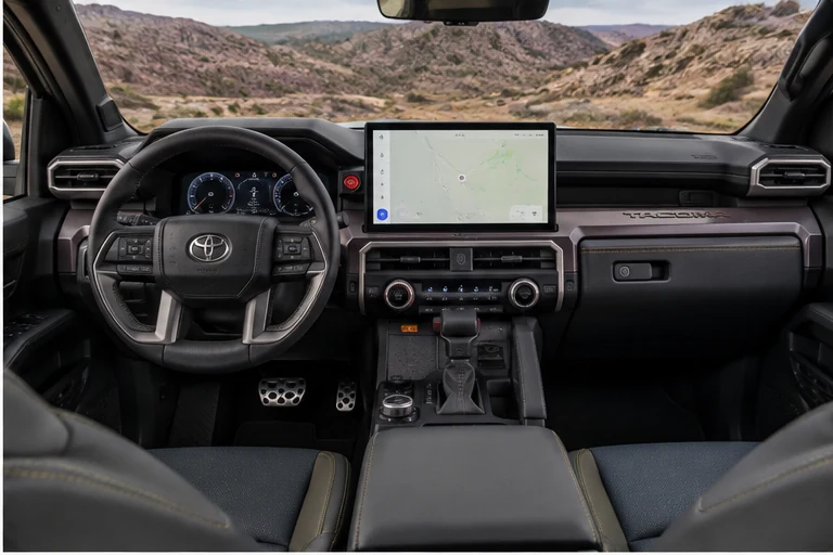 Illustrative modern Toyota Tacoma-style cockpit with central touchscreen