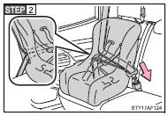 Run the seat belt through the child seat and insert the plate into the buckle.