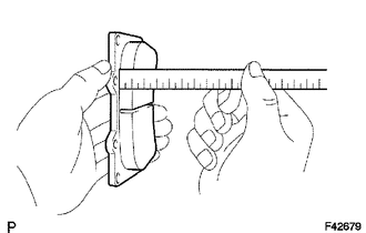 (a) Using a ruler, measure the pad lining thickness.
